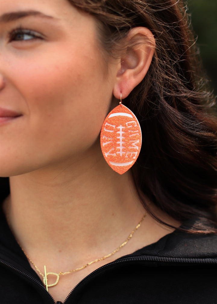 White Metal and Orange Glitter Gameday Football 2" Earrings